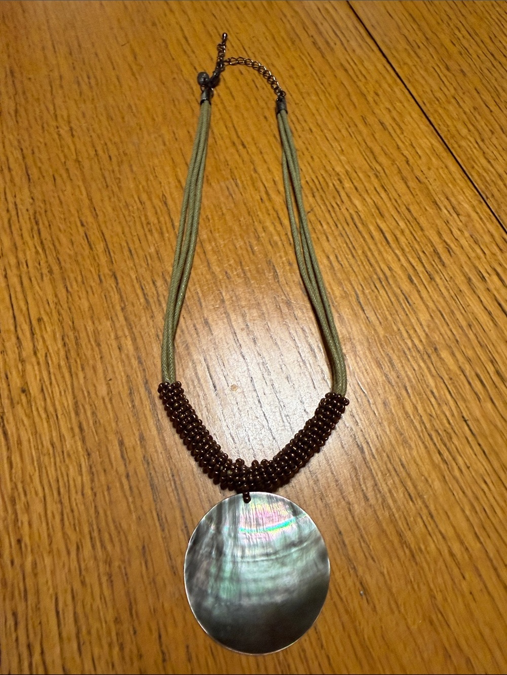 Lia Sophia Olive Cord Necklace with Iridescent Shell Pendant and Brown Beads